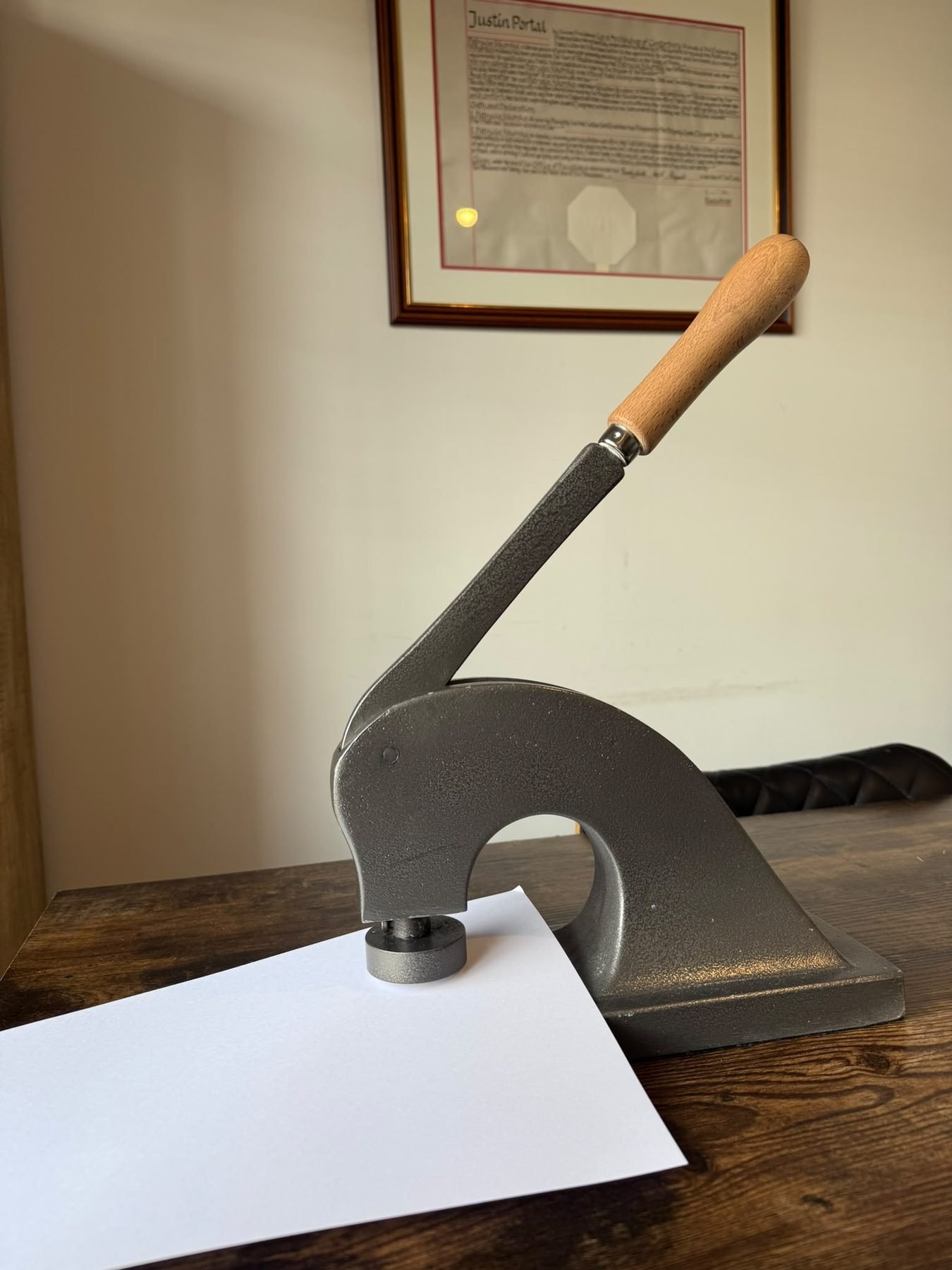 The notarial seal press, used to emboss the notary&rsquo;s mark onto a document
